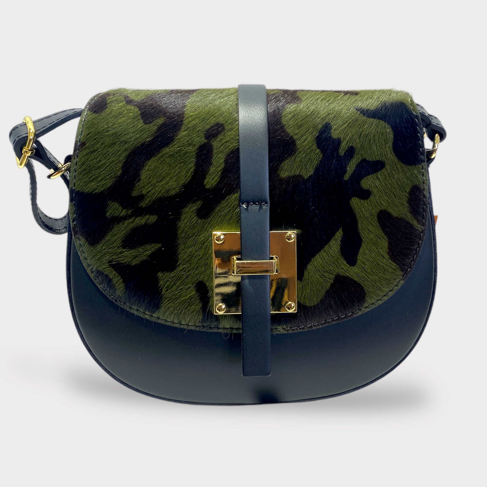 leather handbag with camouflage fur pattern on the front and black leather on the rest, featuring a buckle closure, an adjustable shoulder strap, and a zippered compartment.