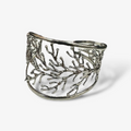 Silver branch-like bracelet on a white background