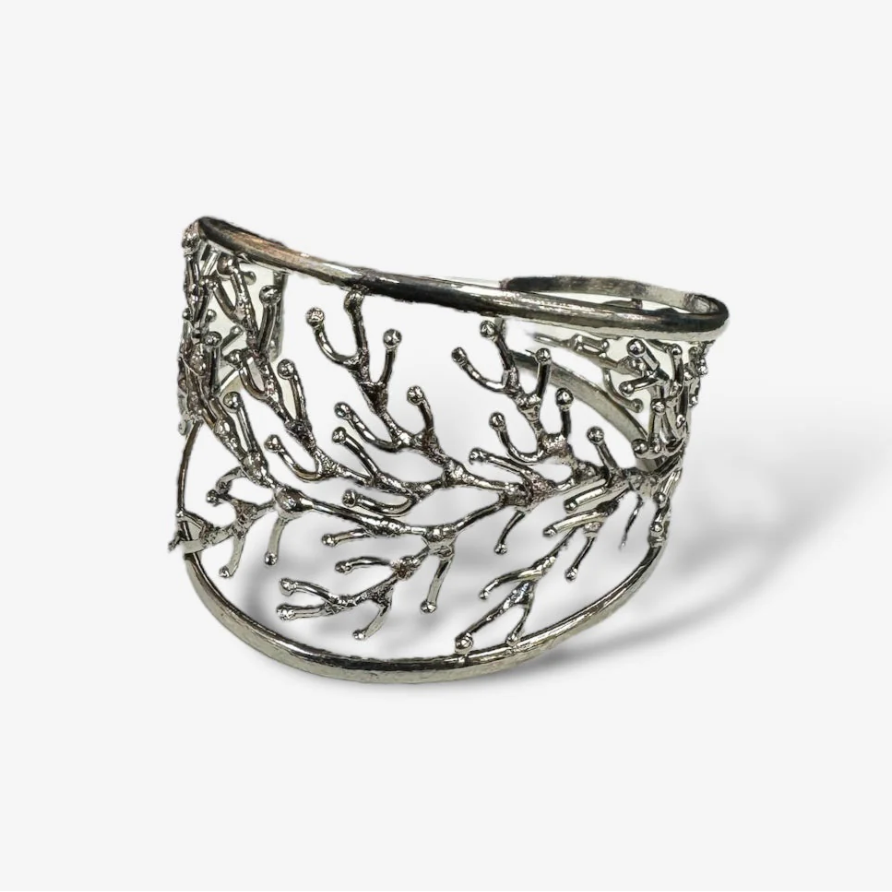 Silver branch-like bracelet on a white background